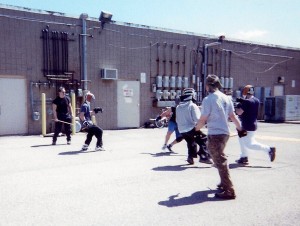 Mataas Na Guro Latorre and Chris Renz managing a group knife-sparring session in the parking lot